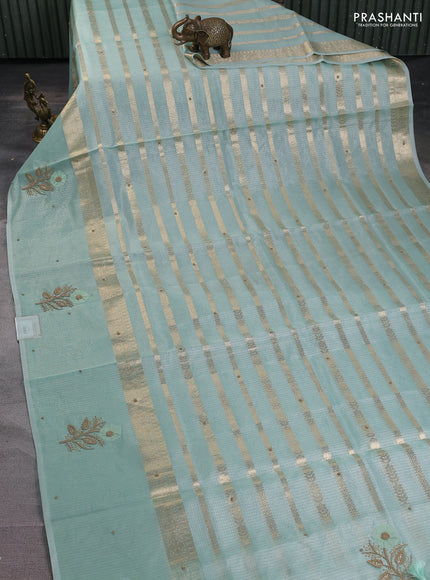 Kota tissue saree teal green with allover zari weaves & embroidery buttas and zari woven embroidery butta border