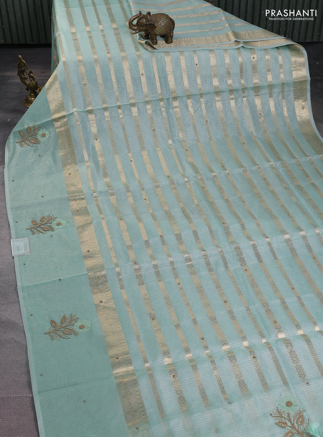 Kota tissue saree teal green with allover zari weaves & embroidery buttas and zari woven embroidery butta border