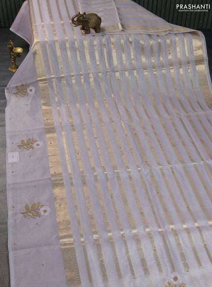 Kota tissue saree pastel lavender with allover zari weaves & embroidery buttas and zari woven embroidery butta border