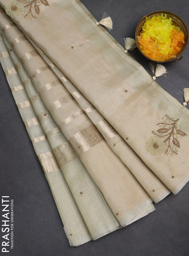 Kota tissue saree mild pista green and sandal with allover zari weaves & embroidery buttas and zari woven embroidery butta border