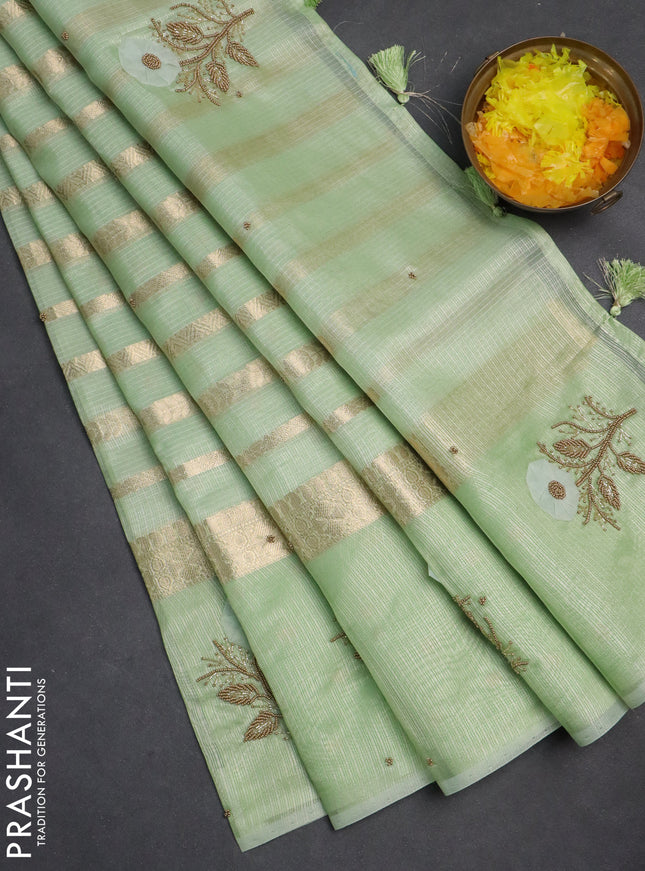 Kota tissue saree pista green with allover zari weaves & embroidery buttas and zari woven embroidery butta border