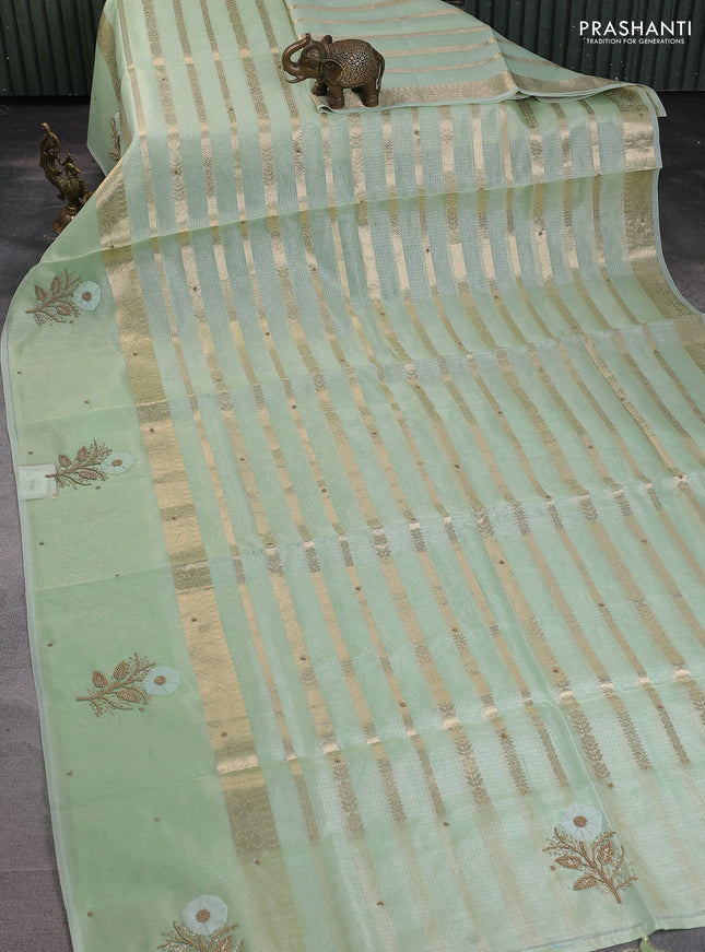 Kota tissue saree pista green with allover zari weaves & embroidery buttas and zari woven embroidery butta border