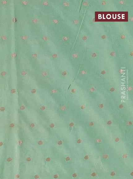 Kota tissue saree pista green with allover zari weaves & embroidery buttas and zari woven embroidery butta border