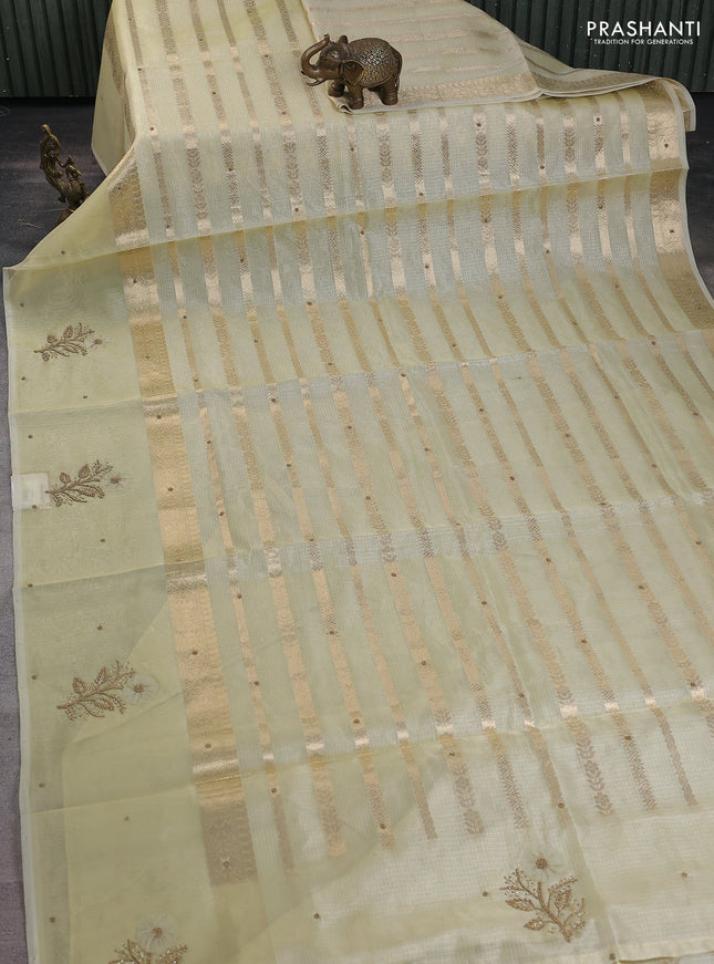 Kota tissue saree pale yellow with allover zari weaves & embroidery buttas and zari woven embroidery butta border