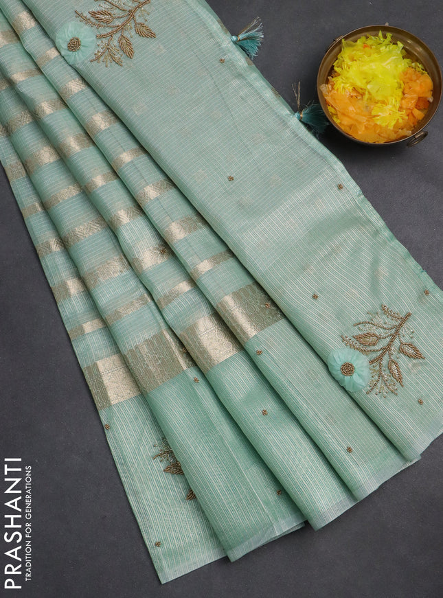 Kota tissue saree teal green with allover zari weaves & embroidery buttas and zari woven embroidery butta border