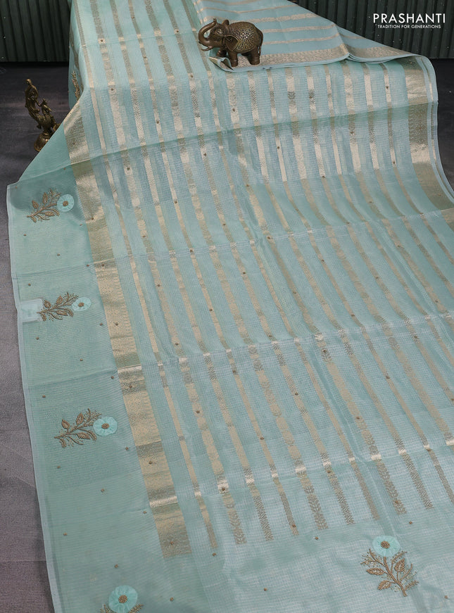 Kota tissue saree teal green with allover zari weaves & embroidery buttas and zari woven embroidery butta border