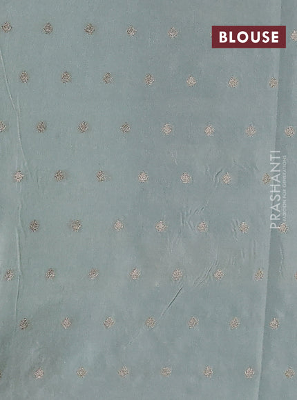 Kota tissue saree teal green with allover zari weaves & embroidery buttas and zari woven embroidery butta border