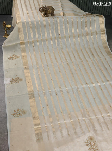 Kota tissue saree beige with allover zari weaves & embroidery buttas and zari woven embroidery butta border