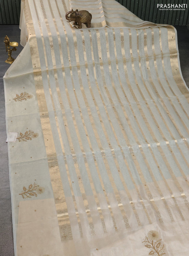 Kota tissue saree beige with allover zari weaves & embroidery buttas and zari woven embroidery butta border