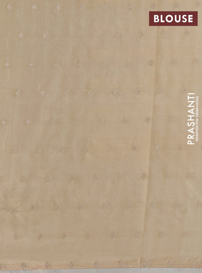 Kota tissue saree beige with allover zari weaves & embroidery buttas and zari woven embroidery butta border