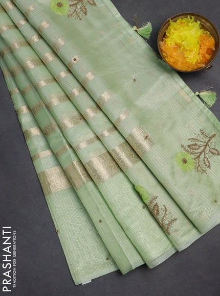 Kota tissue saree pista green with allover zari weaves & embroidery buttas and zari woven embroidery butta border