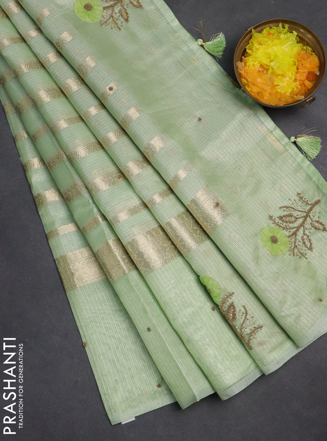 Kota tissue saree pista green with allover zari weaves & embroidery buttas and zari woven embroidery butta border