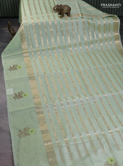 Kota tissue saree pista green with allover zari weaves & embroidery buttas and zari woven embroidery butta border