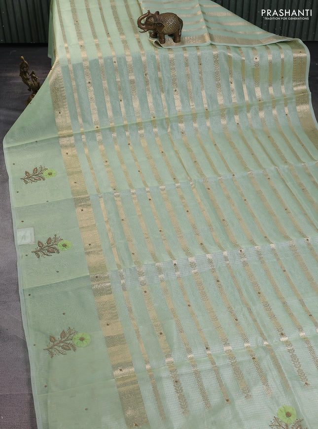 Kota tissue saree pista green with allover zari weaves & embroidery buttas and zari woven embroidery butta border