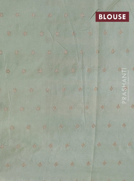 Kota tissue saree pista green with allover zari weaves & embroidery buttas and zari woven embroidery butta border