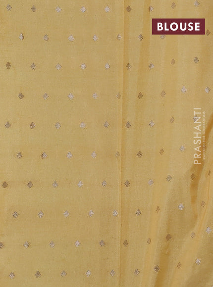 Kota tissue saree pale yellow with allover zari weaves & embroidery buttas and zari woven embroidery butta border