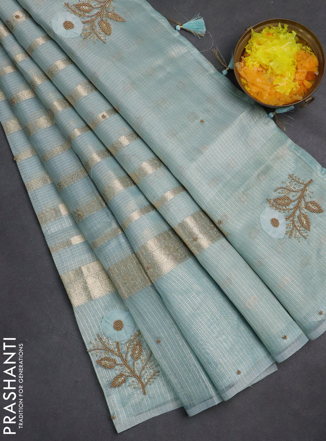 Kota tissue saree teal blue with allover zari weaves & embroidery buttas and zari woven embroidery butta border