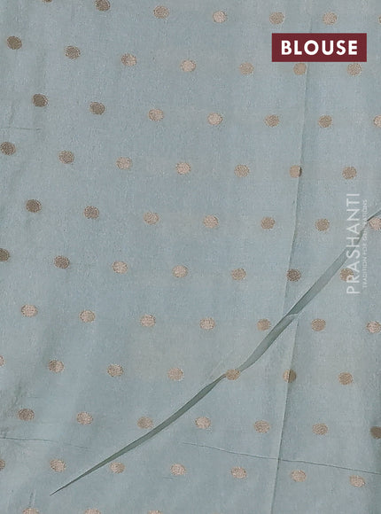 Kota tissue saree teal blue with allover zari weaves & embroidery buttas and zari woven embroidery butta border