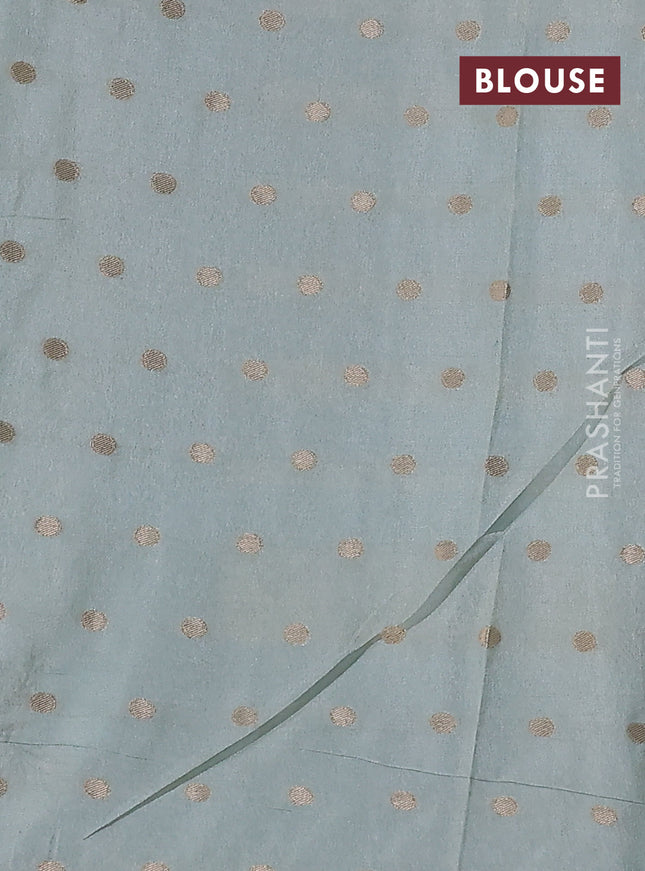 Kota tissue saree teal blue with allover zari weaves & embroidery buttas and zari woven embroidery butta border