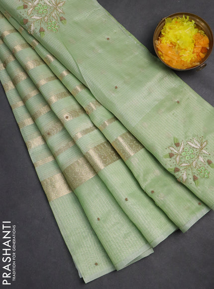 Kota tissue saree pista green with allover zari weaves & embroidery buttas and embroidery butta border