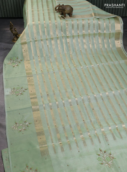 Kota tissue saree pista green with allover zari weaves & embroidery buttas and embroidery butta border