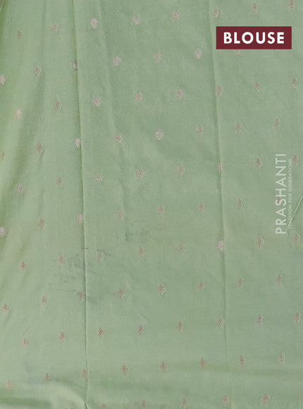Kota tissue saree pista green with allover zari weaves & embroidery buttas and embroidery butta border