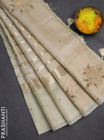 Kota tissue saree sandal with allover zari weaves & embroidery buttas and embroidery butta border