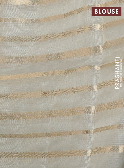 Kota tissue saree sandal with allover zari weaves & embroidery buttas and embroidery butta border