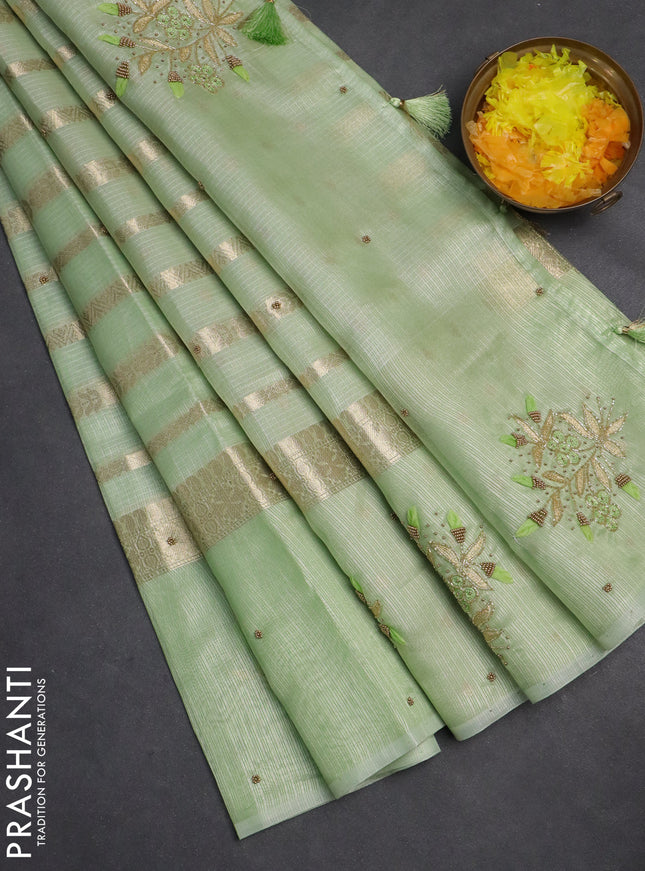 Kota tissue saree pista green with allover zari weaves & embroidery buttas and embroidery butta border