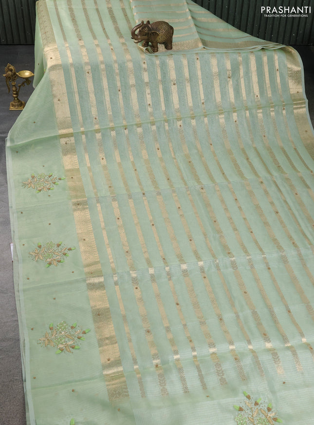 Kota tissue saree pista green with allover zari weaves & embroidery buttas and embroidery butta border
