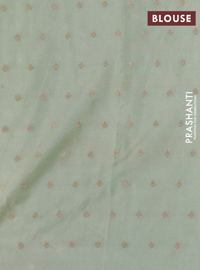 Kota tissue saree pista green with allover zari weaves & embroidery buttas and embroidery butta border