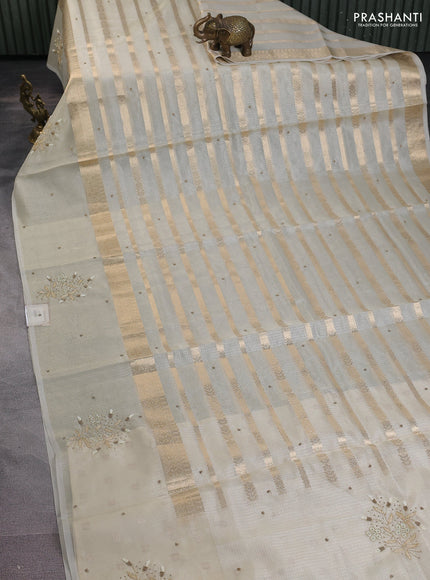 Kota tissue saree beige with allover zari weaves & embroidery buttas and embroidery butta border