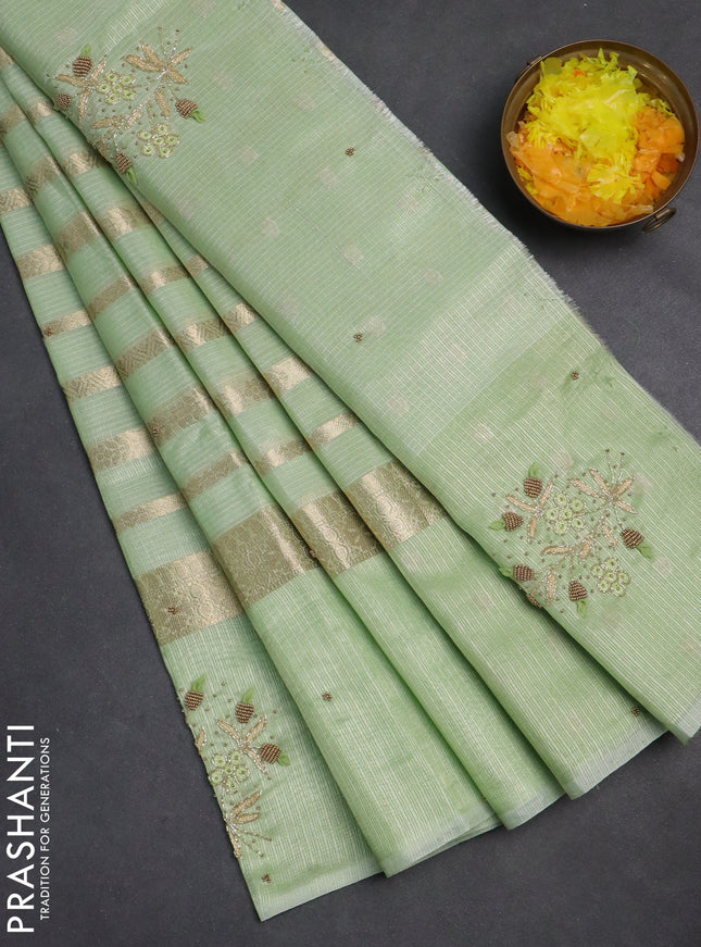 Kota tissue saree pista green with allover zari weaves & embroidery buttas and embroidery butta border