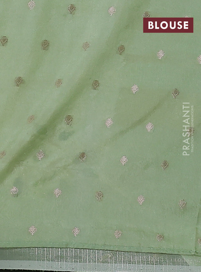 Kota tissue saree pista green with allover zari weaves & embroidery buttas and embroidery butta border