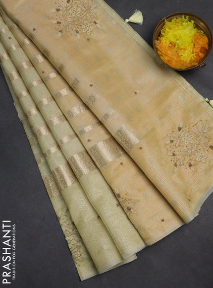 Kota tissue saree pista green with allover zari weaves & embroidery buttas and embroidery butta border