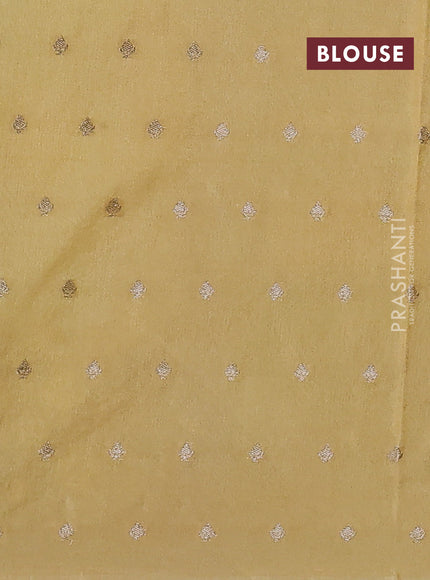 Kota tissue saree pista green with allover zari weaves & embroidery buttas and embroidery butta border