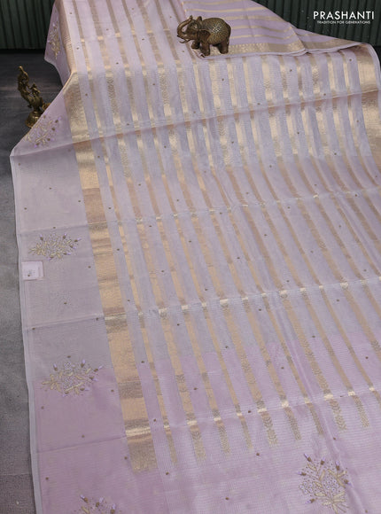 Kota tissue saree mild lavendar with allover zari weaves & embroidery buttas and embroidery butta border