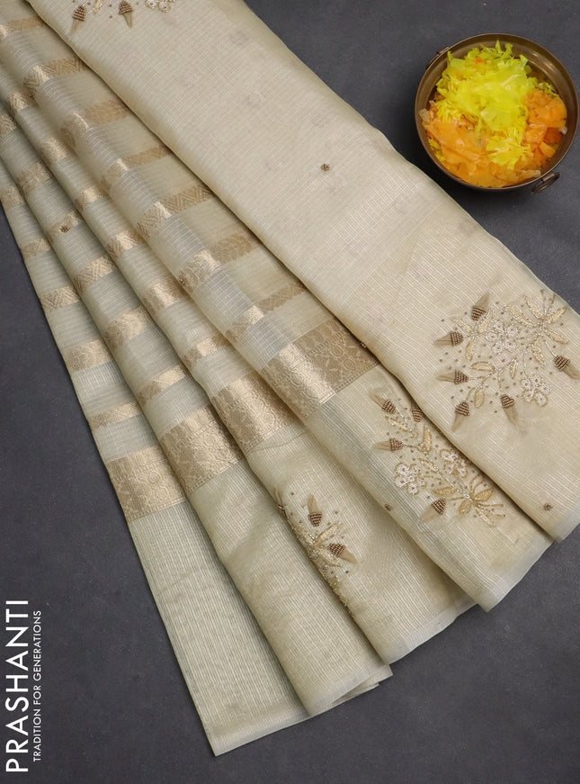 Kota tissue saree sandal with allover zari weaves & embroidery buttas and embroidery butta border