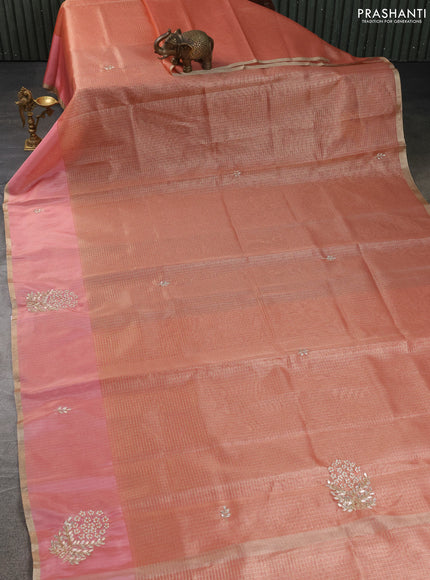 Kota tissue saree peach shade with allover zari weaves embroidery buttas and embroidery butta border