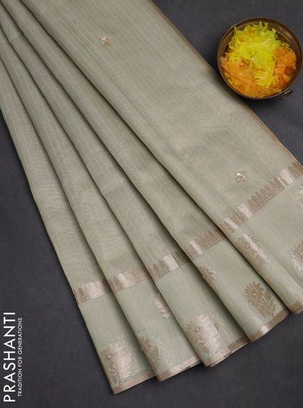 Kota tissue saree pastel green with embroidery buttas and zari woven butta border