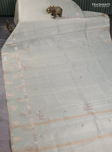 Kota tissue saree pastel green with embroidery buttas and zari woven butta border