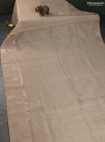 Kota tissue saree beige with embroidery buttas and zari woven butta border