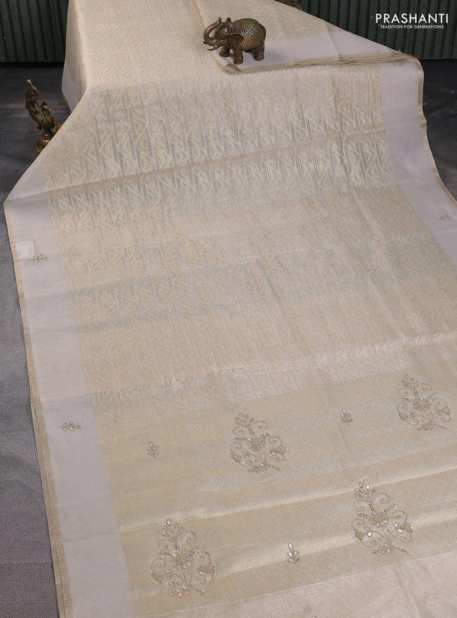 Kota tissue saree beige with allover zari weaves and embroidered butta boder