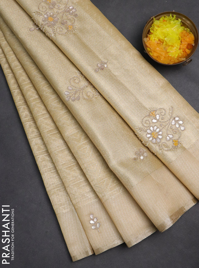 Kota tissue saree sandal with allover zari weaves and embroidered butta boder