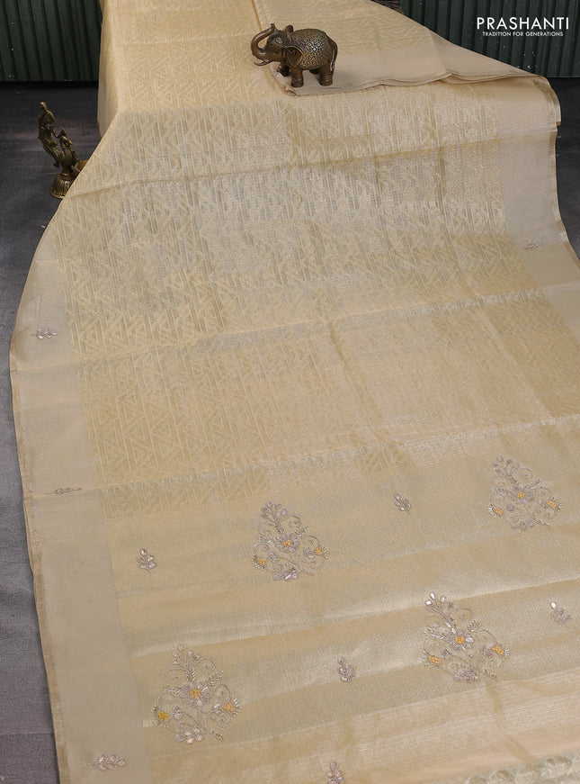 Kota tissue saree sandal with allover zari weaves and embroidered butta boder