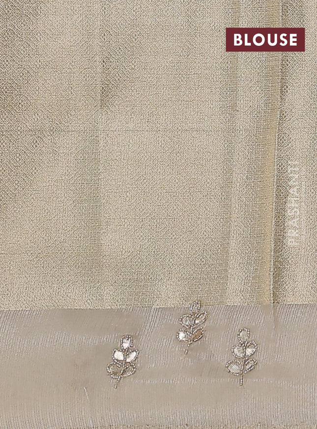 Kota tissue saree sandal with allover zari weaves and embroidered butta boder