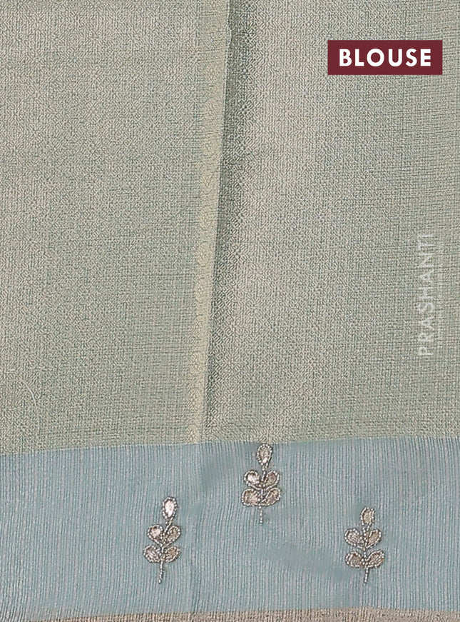 Kota tissue saree teal blue with allover zari weaves and embroidered butta boder