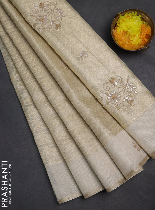 Kota tissue saree beige with allover zari weaves and embroidered butta boder