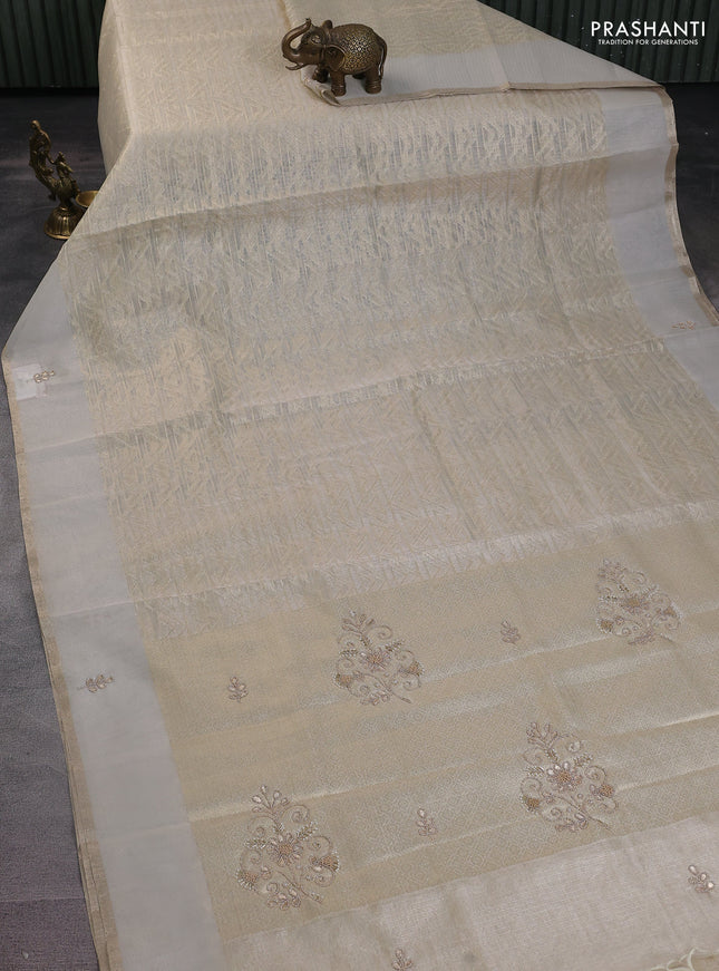 Kota tissue saree beige with allover zari weaves and embroidered butta boder