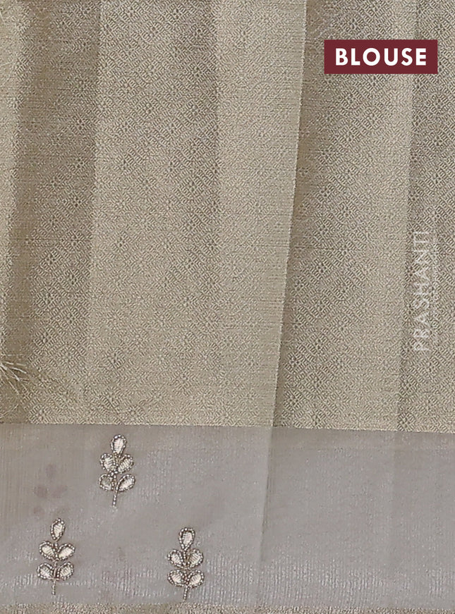 Kota tissue saree beige with allover zari weaves and embroidered butta boder